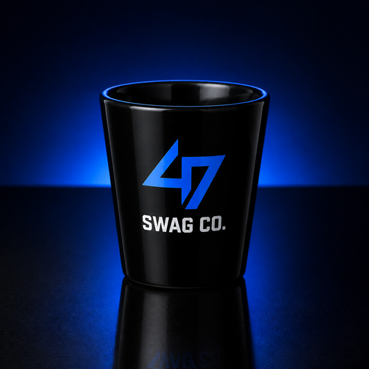 Black custom 2 oz coated shot glass with 47 Swag Co branding