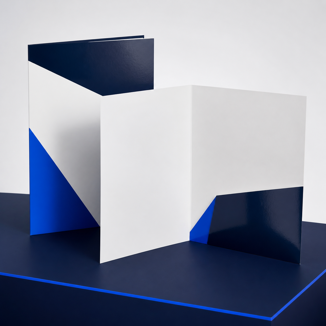 Premium 9 x 12 presentation folder shown closed and open with a single right pocket in navy, white, and electric blue