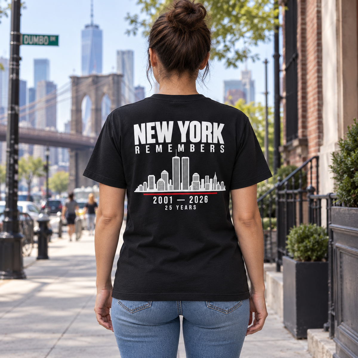 Back view of model wearing black New York Remembers skyline memorial T-shirt