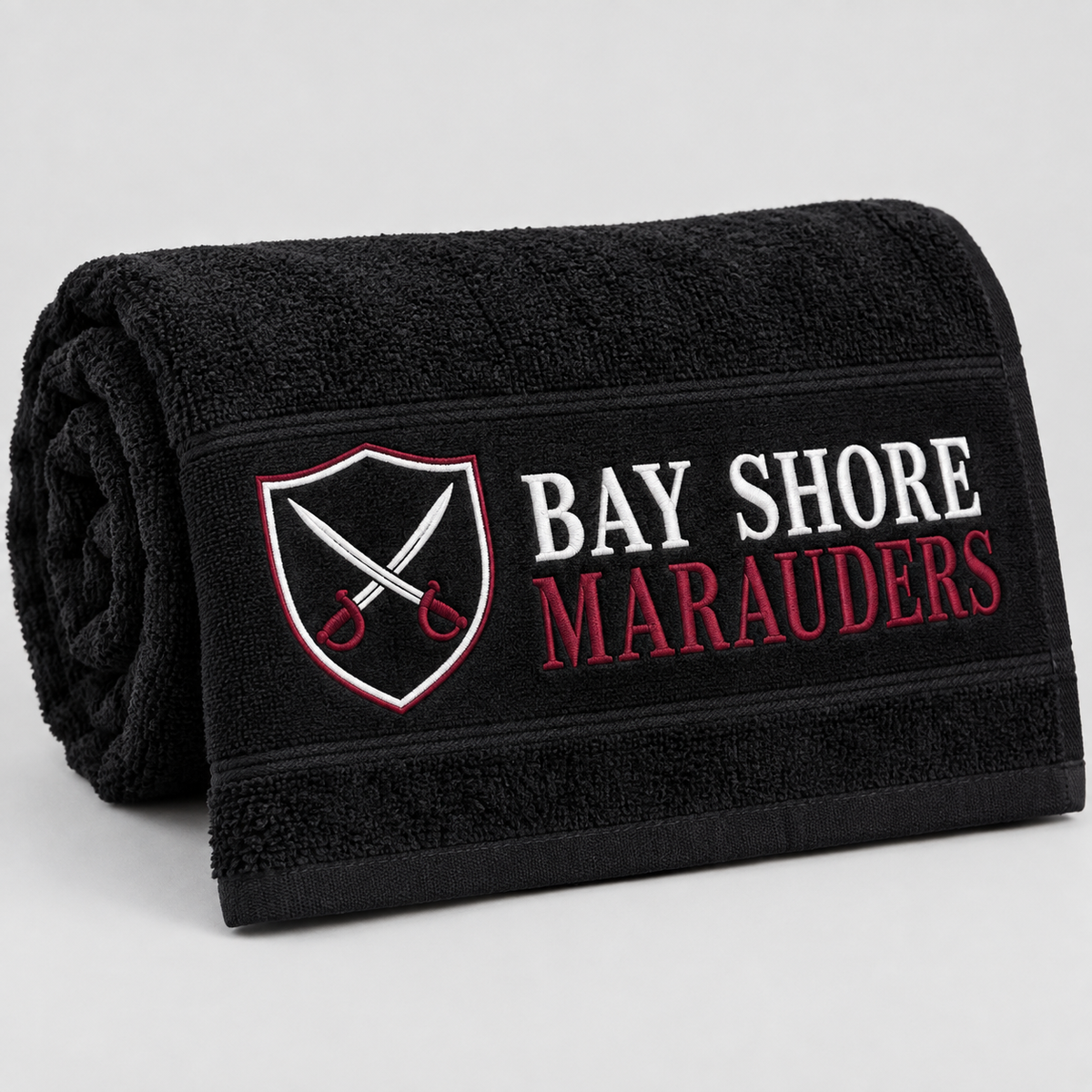 Bay Shore Marauders black beach towel, rolled detail view