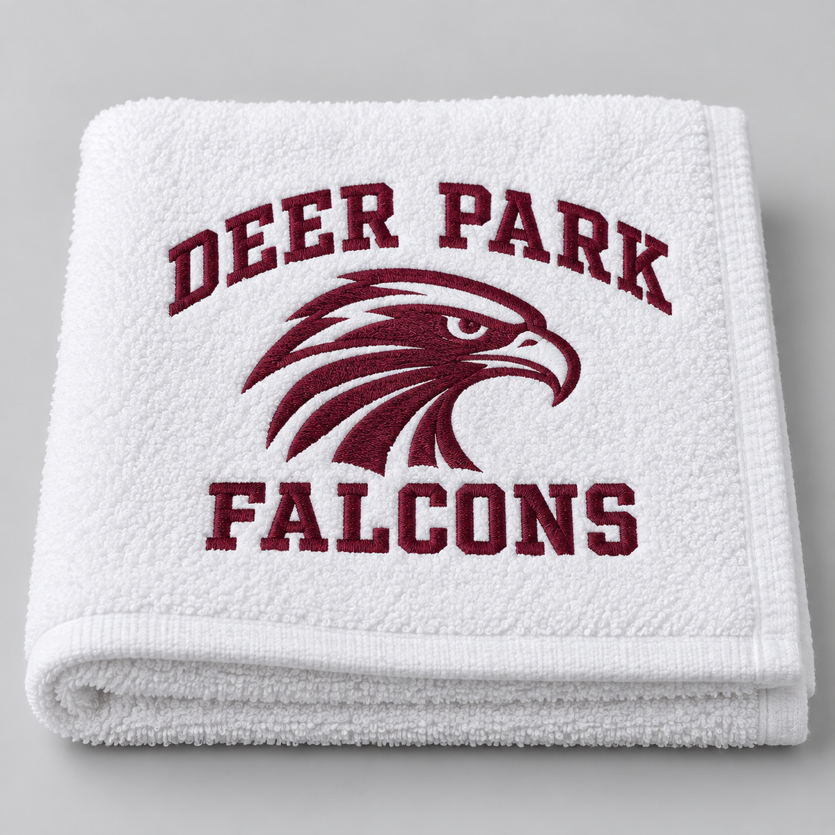 Deer Park Falcons white beach towel, folded detail view