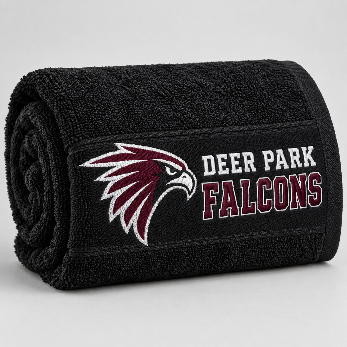 Deer Park Falcons black beach towel, rolled detail view