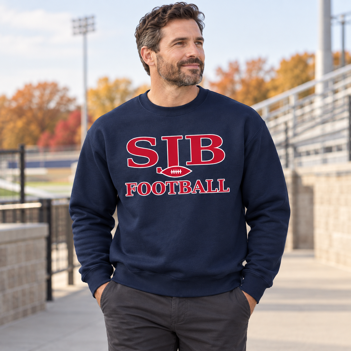 Adult supporter wearing navy SJB Football crewneck