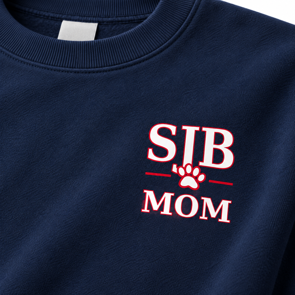 Close view of SJB Mom left-chest print on navy fleece